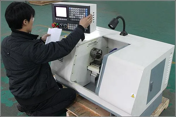 KEYU machinist operating a CNC lathe used for metal keyboard components