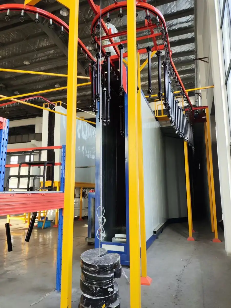 Overhead conveyor line inside the newly started drive shaft plant
