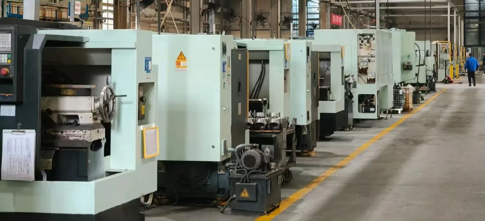 Line of CNC machining centres running inside the partner plant