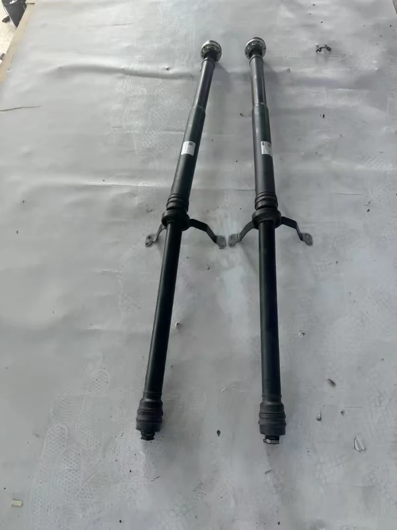 Two propeller shaft assemblies laid out for measurement
