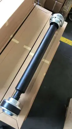 Two piece propeller shaft with centre bearing laid in its shipping carton