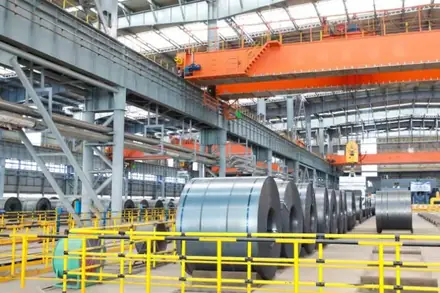 Steel coil stock held in a rolling mill warehouse