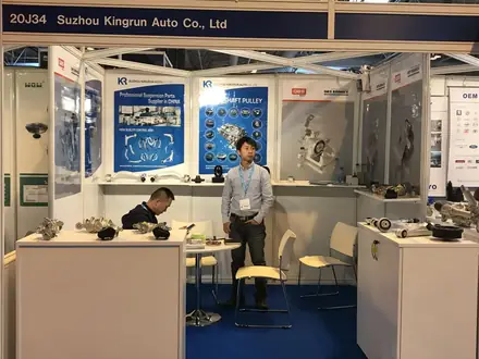 Kingrun Auto stand showing transmission pulley panels at an aftermarket exhibition