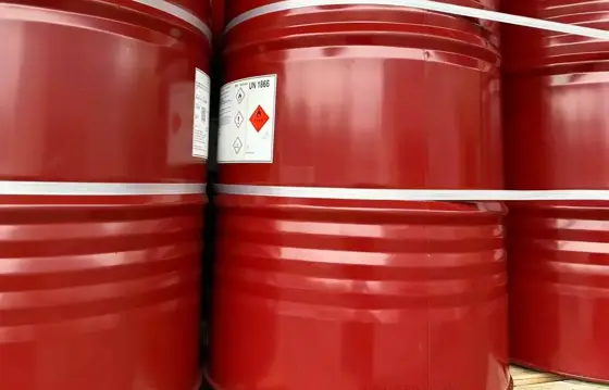 Sealed red steel drums of polyisocyanate curing agent with hazard labels