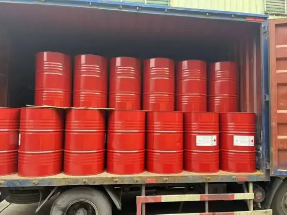 Red steel drums of isocyanate raw material loaded in a shipping container