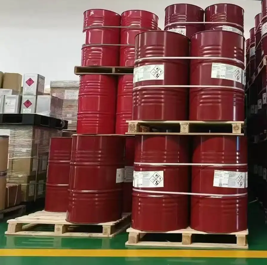 Sealed drums of chemical raw material palletised in a warehouse