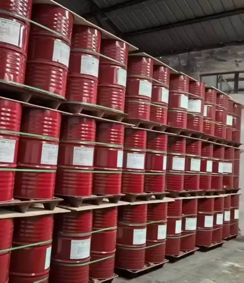 Stacked red drums of MDI raw material in a chemical storage warehouse