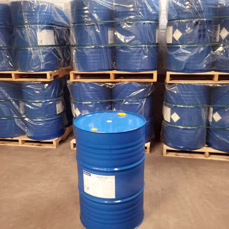 Blue drums of polyetheramine curing agent stacked on wooden pallets