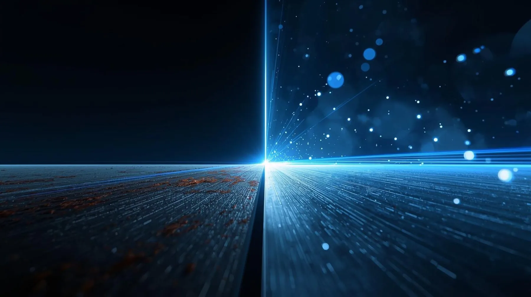 Fibre laser beam pattern over a dark industrial surface