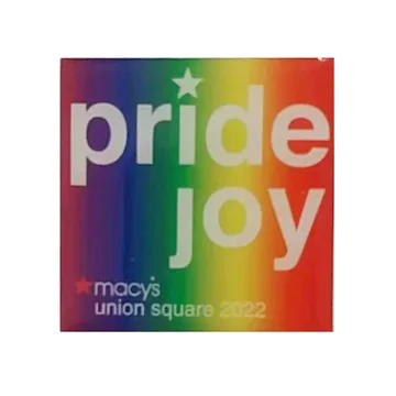 Square printed pride event patch with rainbow lettering on a white ground
