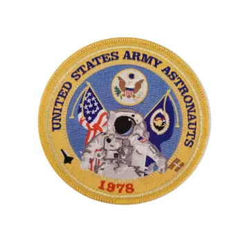 Round woven army astronaut patch with gold border and embroidered detail
