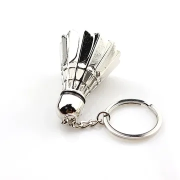 Silver metal shuttlecock keychain on a split ring, white background