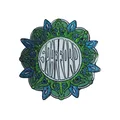 Soft enamel pin with a green leaf border and raised metal lettering