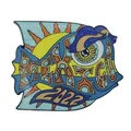 Glitter enamel fish pin in blue orange and purple with a sun motif