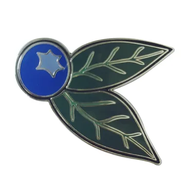 Hard enamel blueberry pin with a star crown and green leaves