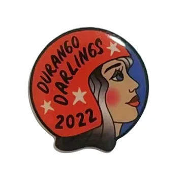Offset printed pin with a red cartoon portrait and star border