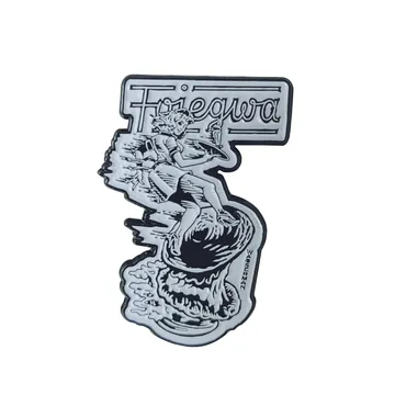 Soft enamel surf pin in black and white with raised metal outlines