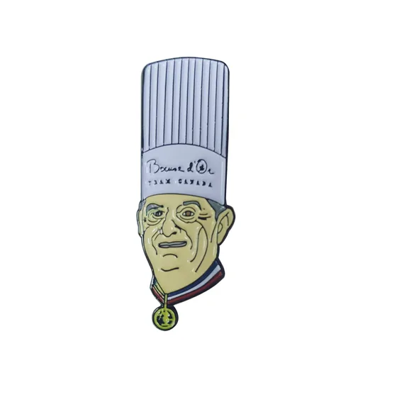 Soft enamel chef head pin with a tall white hat and gold medal