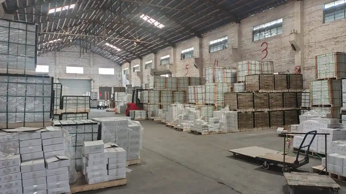 Boxed tile stacked on pallets in the LSDECO warehouse