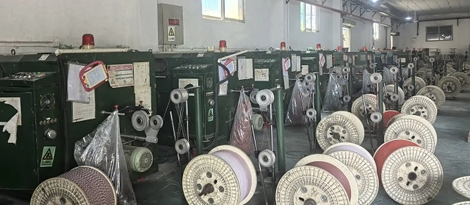 Rows of finished cable reels in the LANP CABLE spooling room