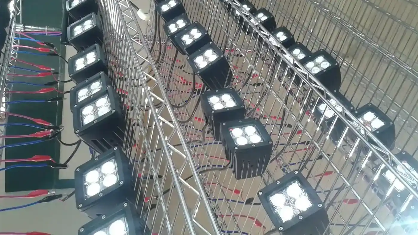 Lantsun LED work lights powered up on the ageing test rack before packing