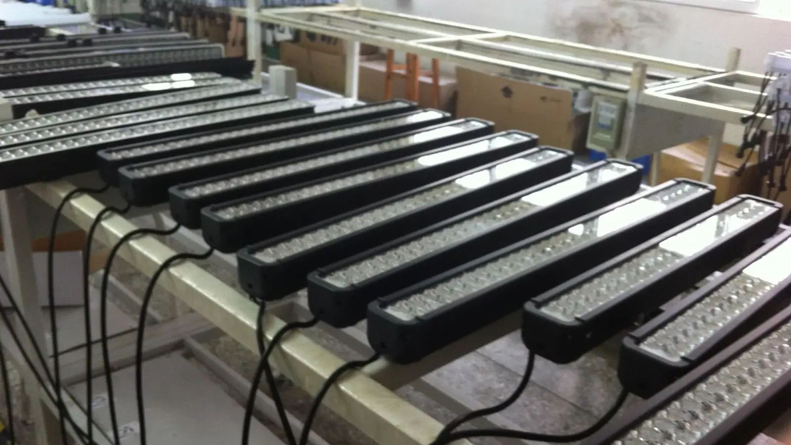 LED light bars lined up on the Lantsun assembly bench during final build