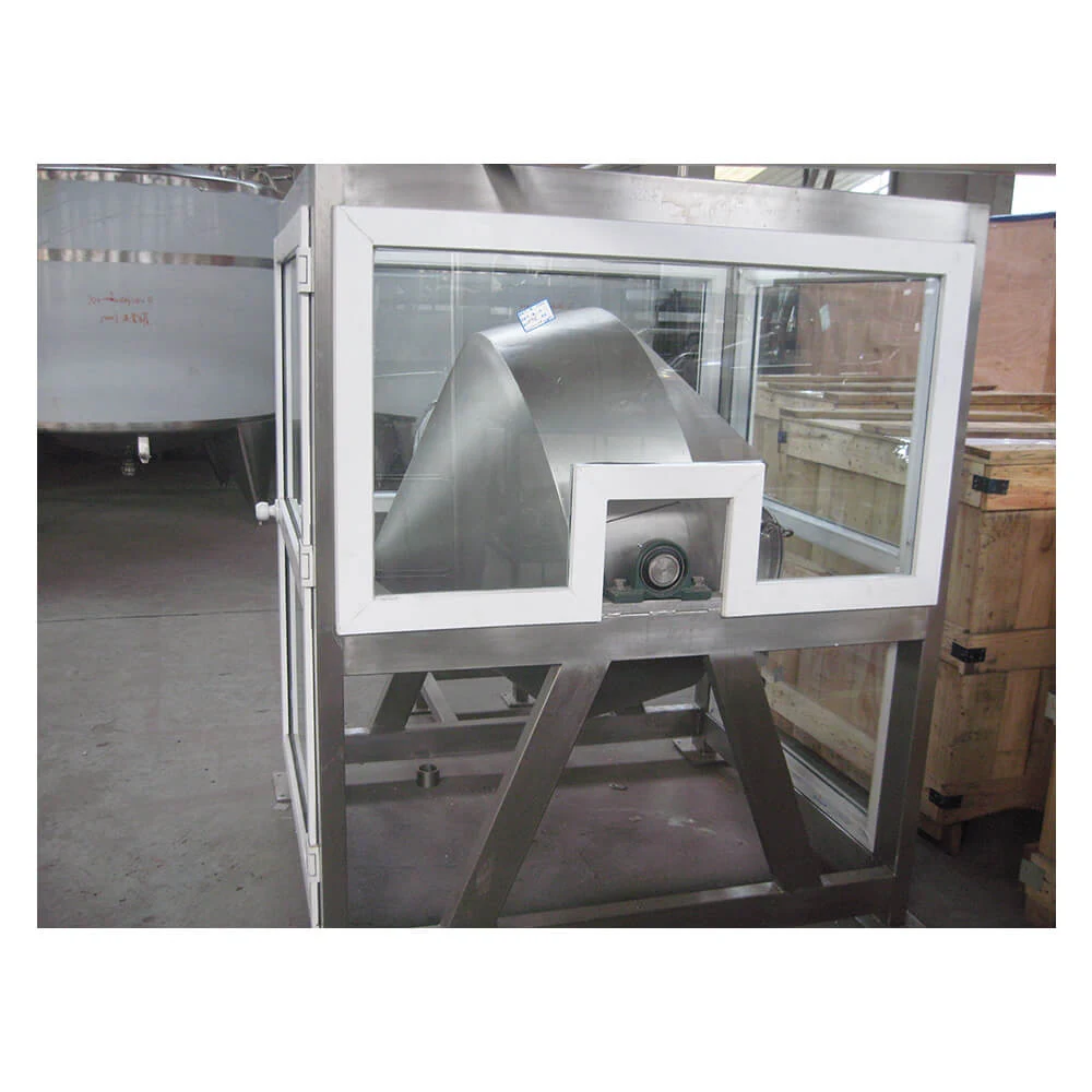 Stainless steel butter churner machine on a dairy production floor