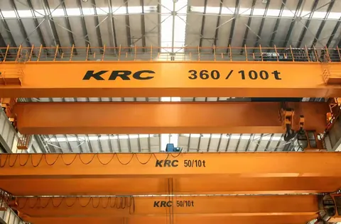 Heavy duty gantry crane lifting a load in an outdoor yard