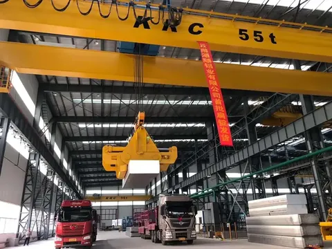 Overhead crane lifting material in an aluminium plant
