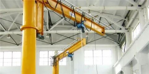 Jib crane boom mounted on a workshop column
