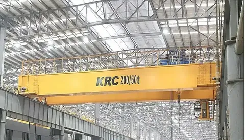 50 ton overhead crane girder and hook block above a workshop floor