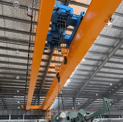Double beam overhead construction crane lifting a load