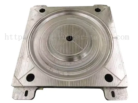 Machined rubber mold half showing the cavity detail