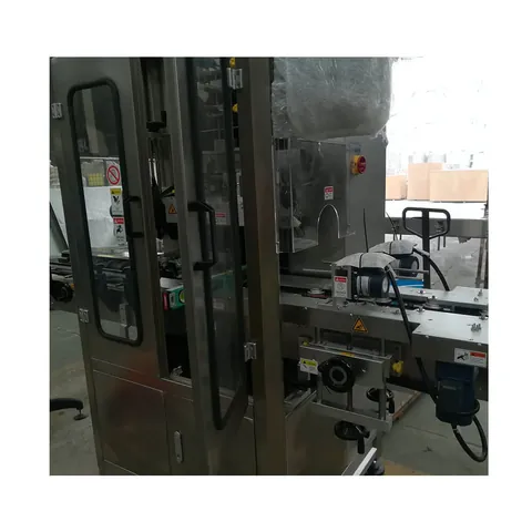 Shrink sleeve labeling machine applying sleeves to bottles