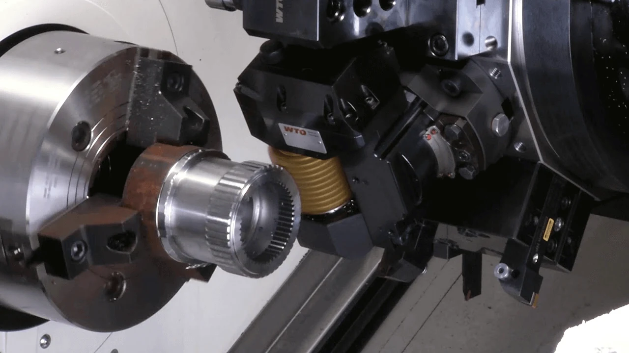 CNC lathe machining a steel component in a Chinese machine shop