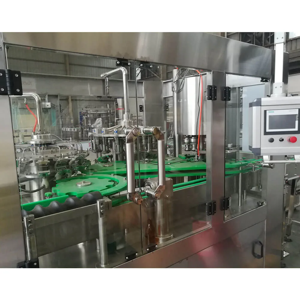 Glass bottle filling machine enclosed behind an organic glass door with rotary filling block