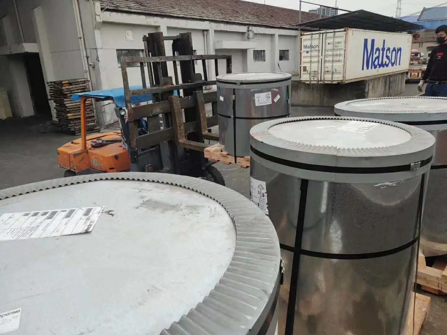 Packed silicon steel coils strapped and wrapped for shipment