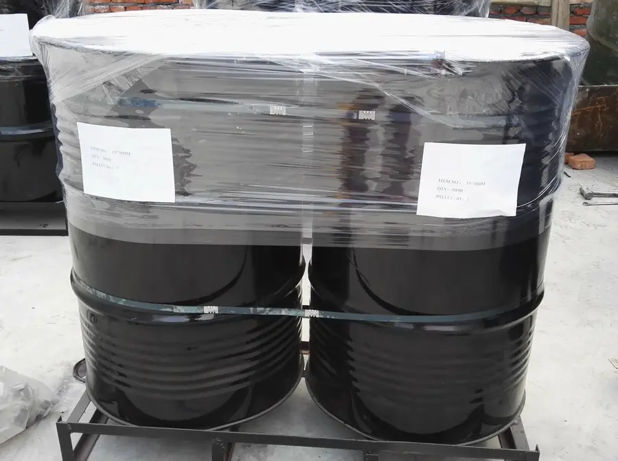 Grade 80 chain packed into steel drums and strapped to a pallet for shipment