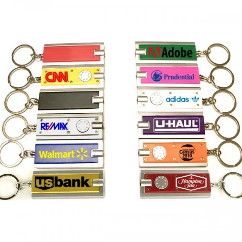 Customized slim bar keychains with built-in flashlight printed with brand logos