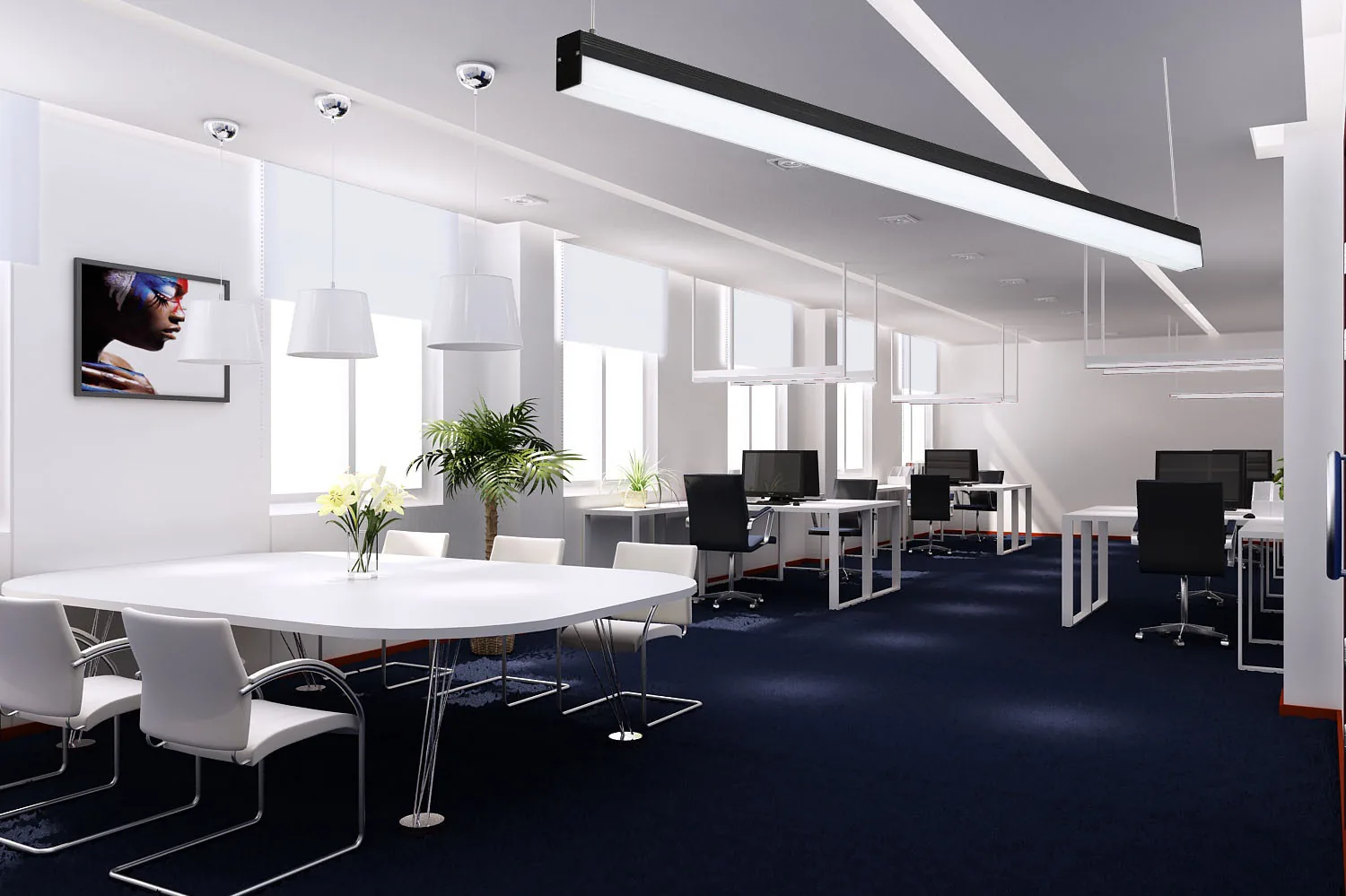 Open plan office with meeting table under suspended linear LED lighting