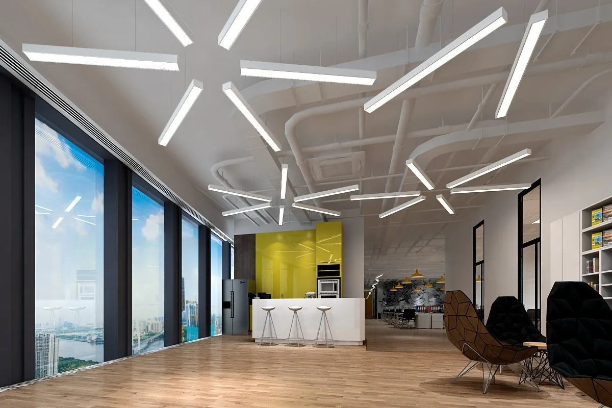 Open plan office lit by suspended linear LED luminaires