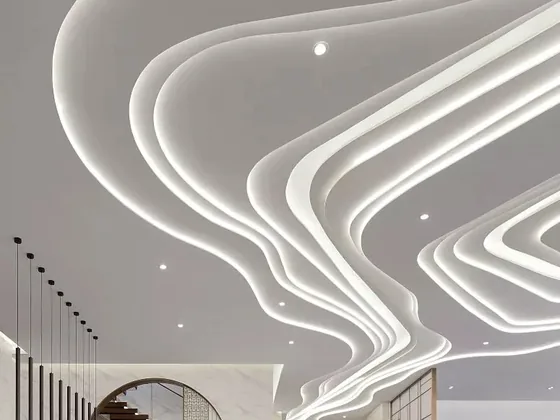 Sculpted ceiling feature formed from curved illuminated LED neon lines