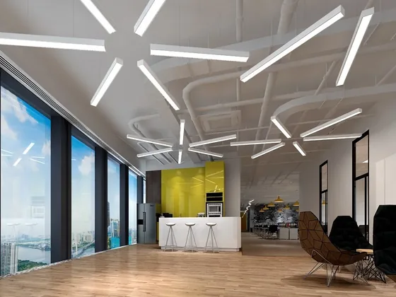 Open plan office lit by suspended linear LED luminaires