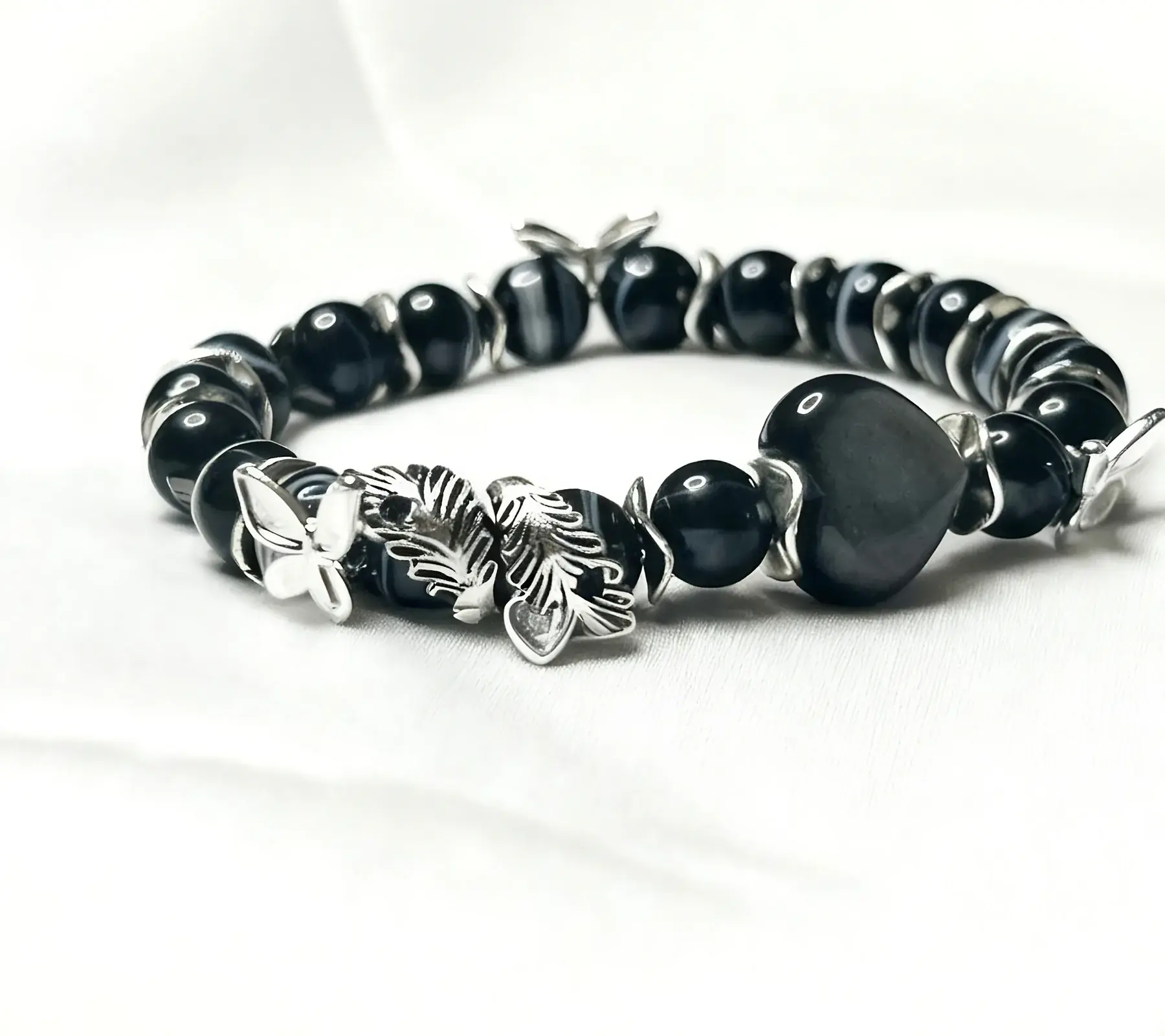 Feather of Purity black Persian agate and silver obsidian crystal bracelet, close view of the beads