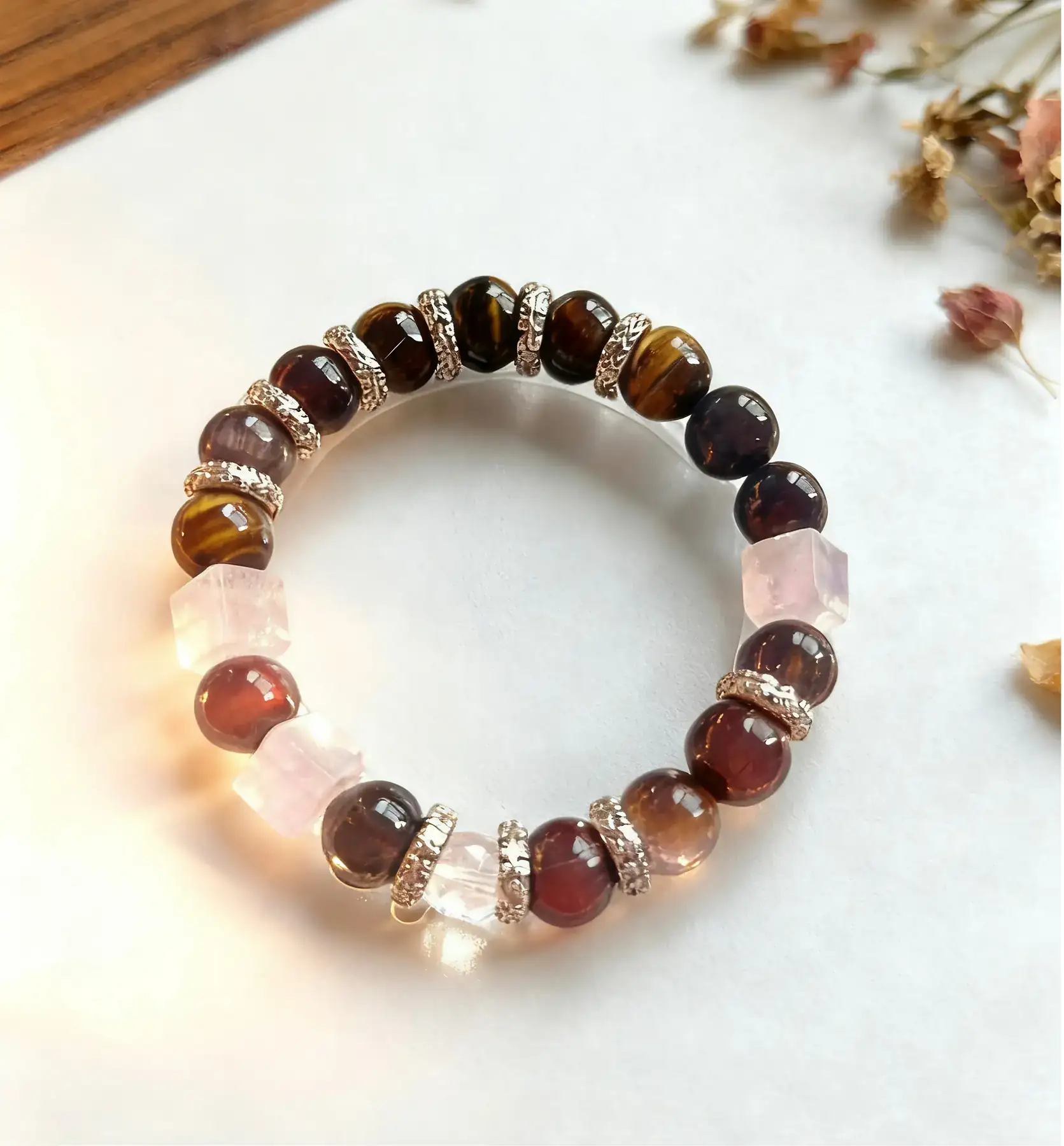 Magic Tiger Spirit rainbow tiger's eye and clear quartz crystal bracelet, the bracelet styled on a surface