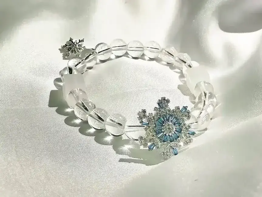 Snow Crystal Condensation clear quartz crystal bracelet, close view of the beads