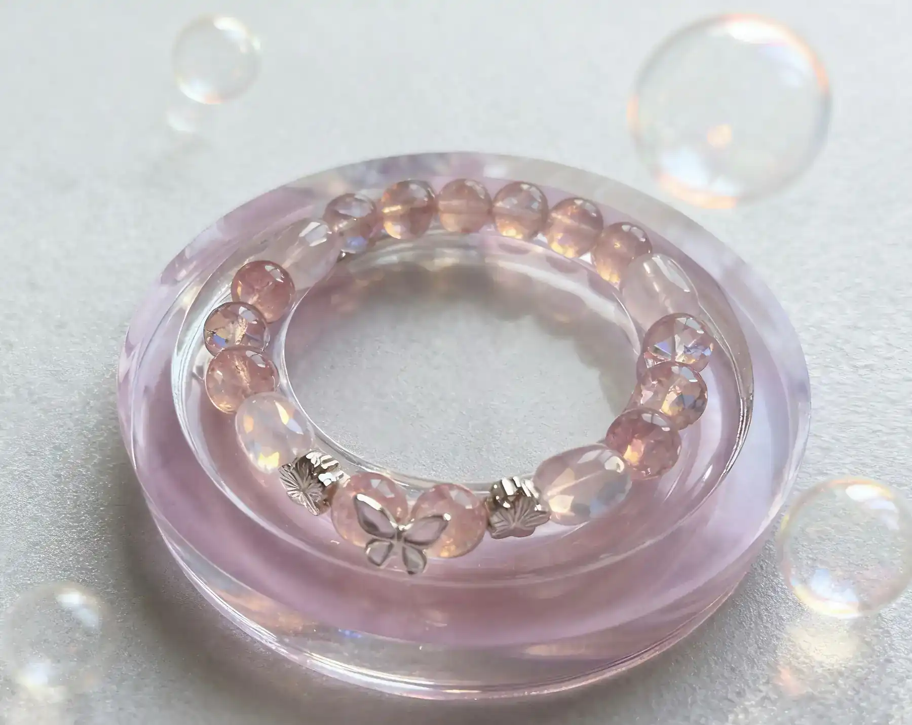 Tender Bond strawberry quartz and rose quartz crystal bracelet, close view of the beads