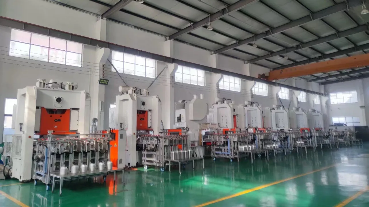 Row of aluminum foil container punching presses on a Chinese factory floor