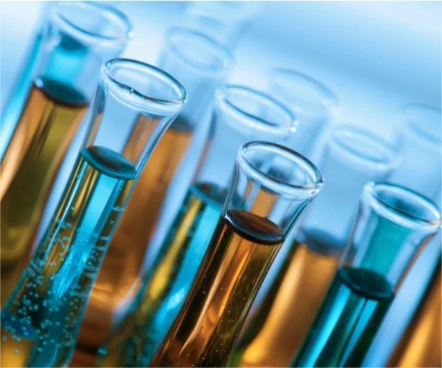 Coating resin samples in laboratory glassware under blue light