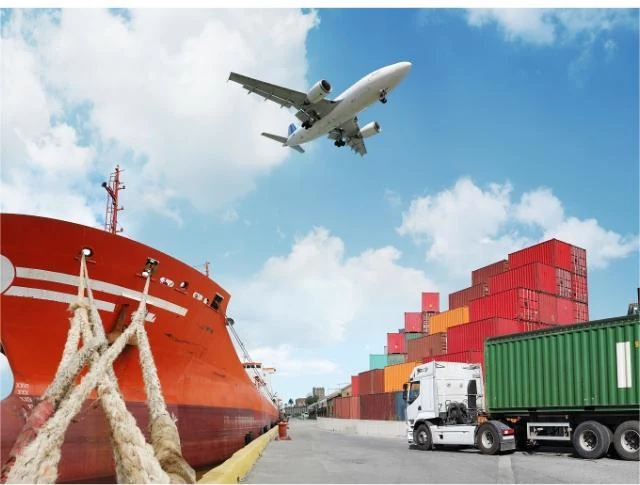 Container ship, stacked freight containers, a truck and a cargo aircraft at a port